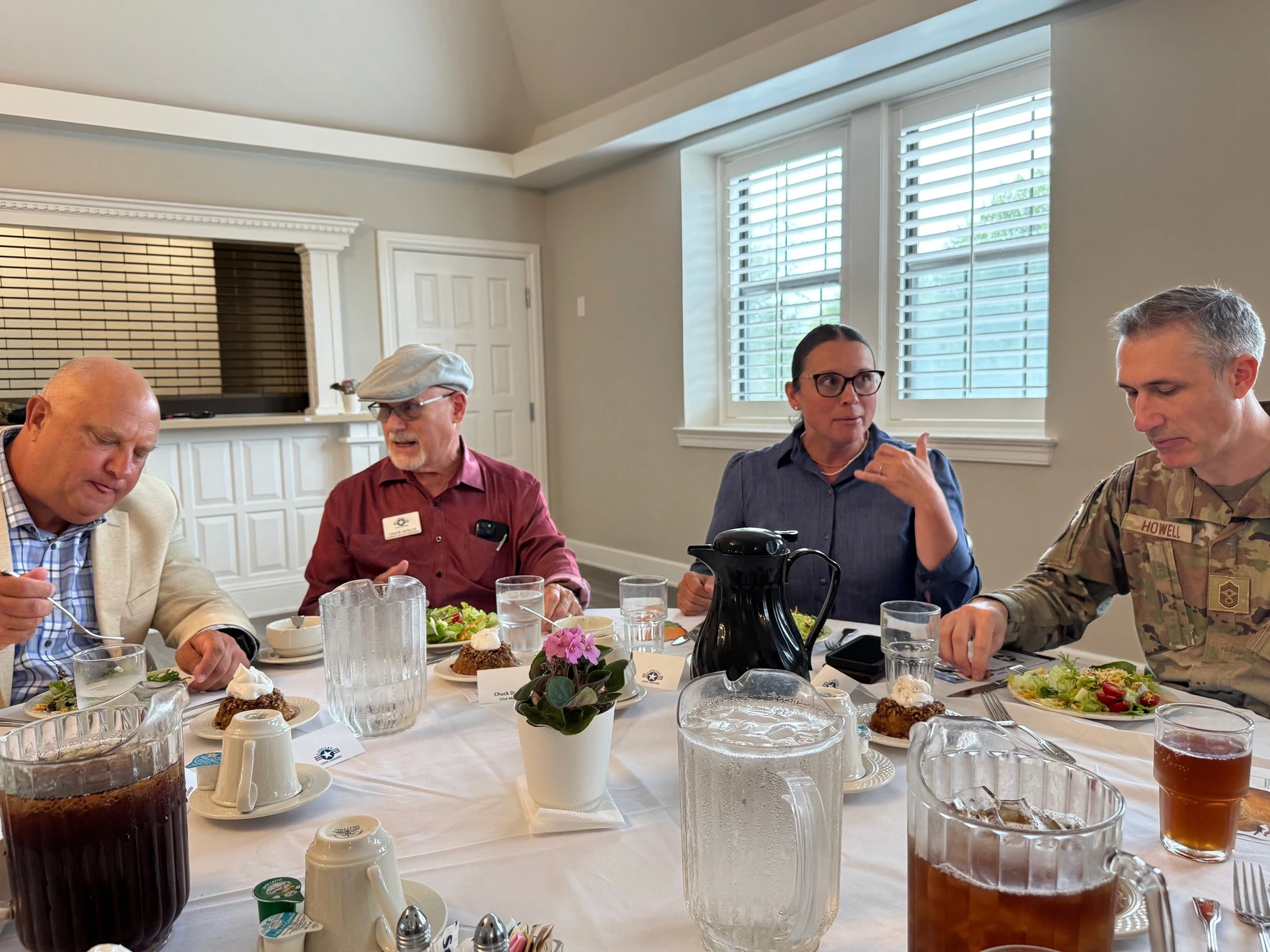 Attendees including Chief Master Sergeant dining at the luncheon